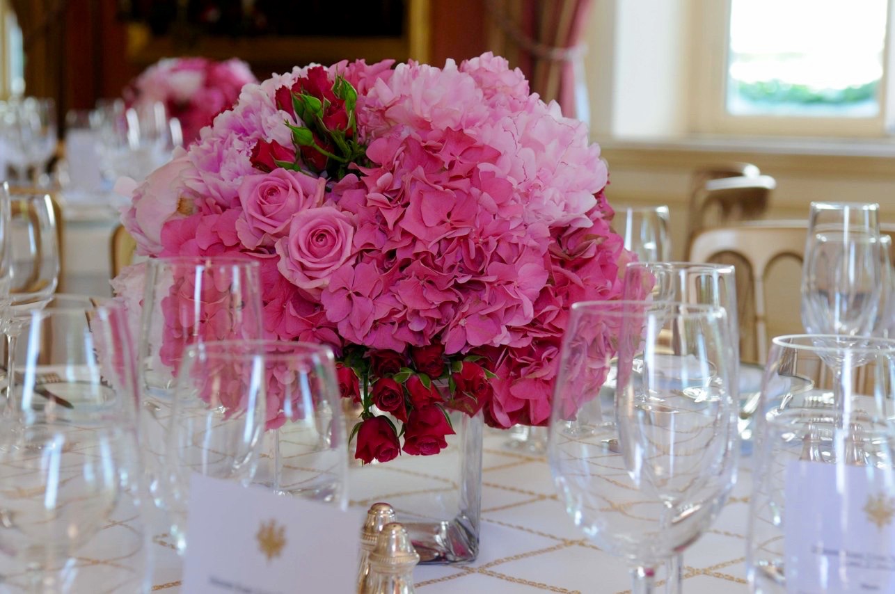 Formal event flowers arranged for a dining setting