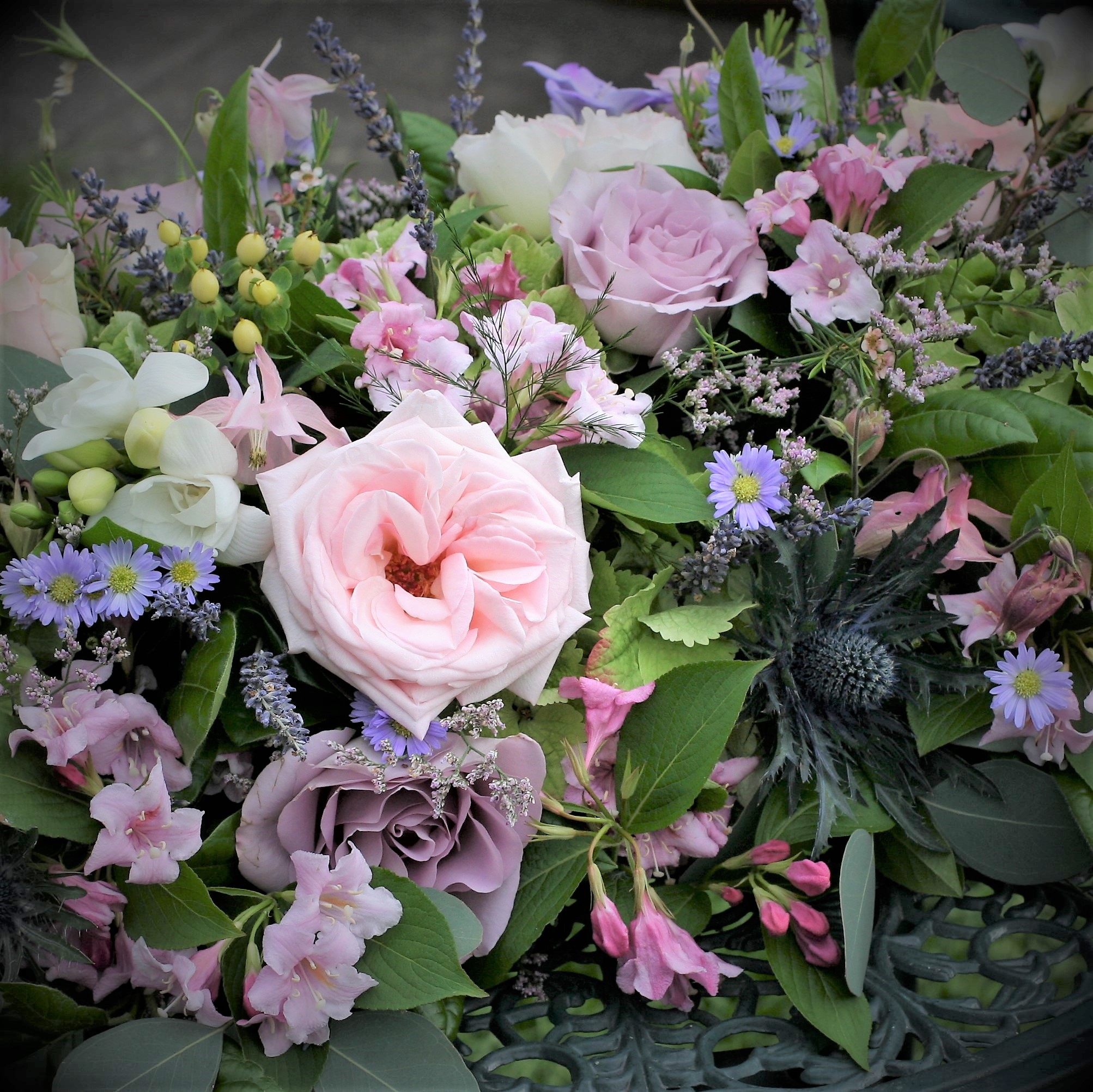 Indoor floral arrangement with soft flowers in a refined interior